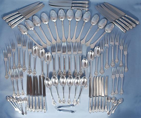 A George V silver canteen of 17th century style lace back trefid pattern cutlery, 110oz/ 3430 grams.